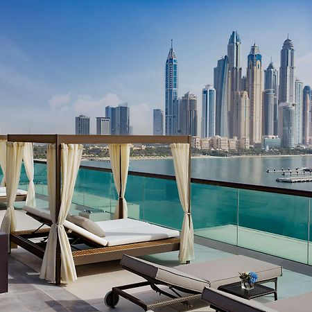 Hilton Dubai Palm Jumeirah Hotel Exterior foto View of the Dubai Marina skyline from the hotel